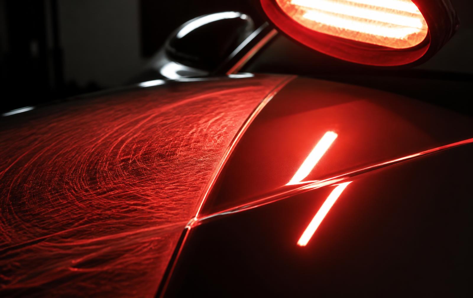 Fine swirl marks vanishing from a glossy panel as the self-healing coating reflows with heat