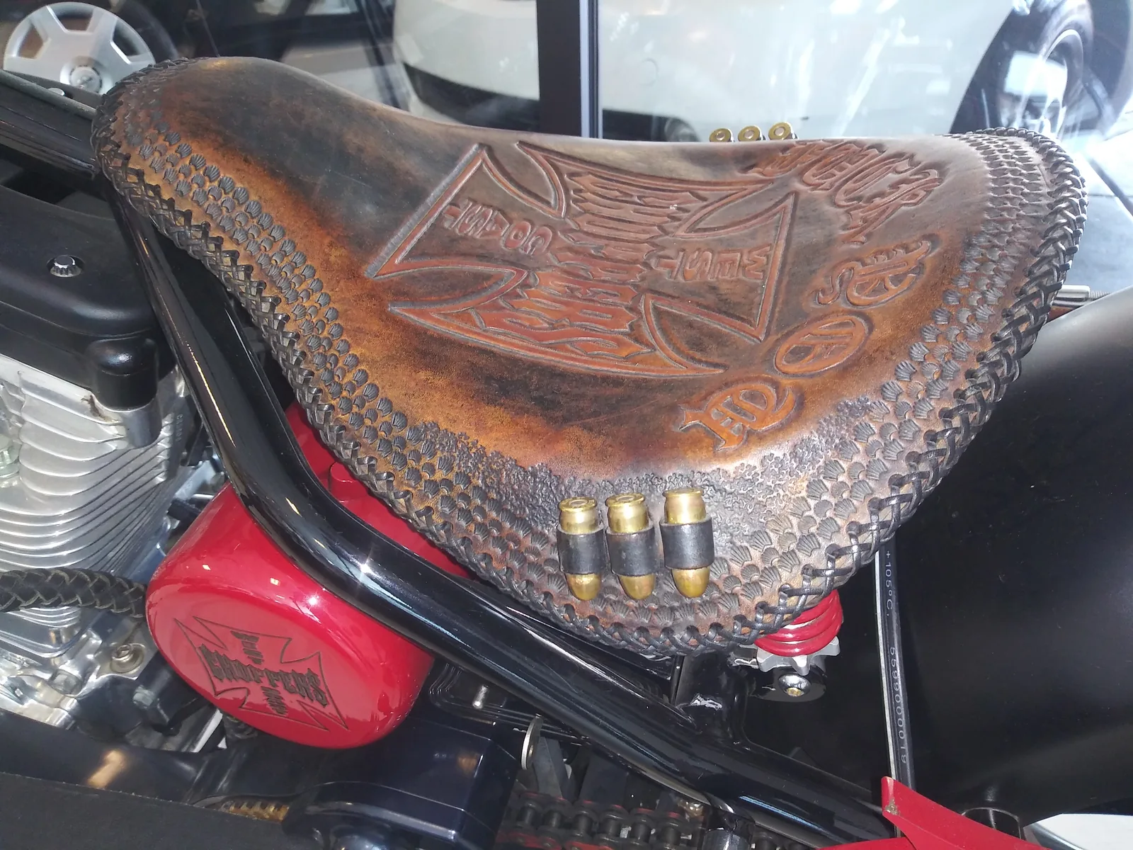 Tooled leather custom motorcycle seat after detailing