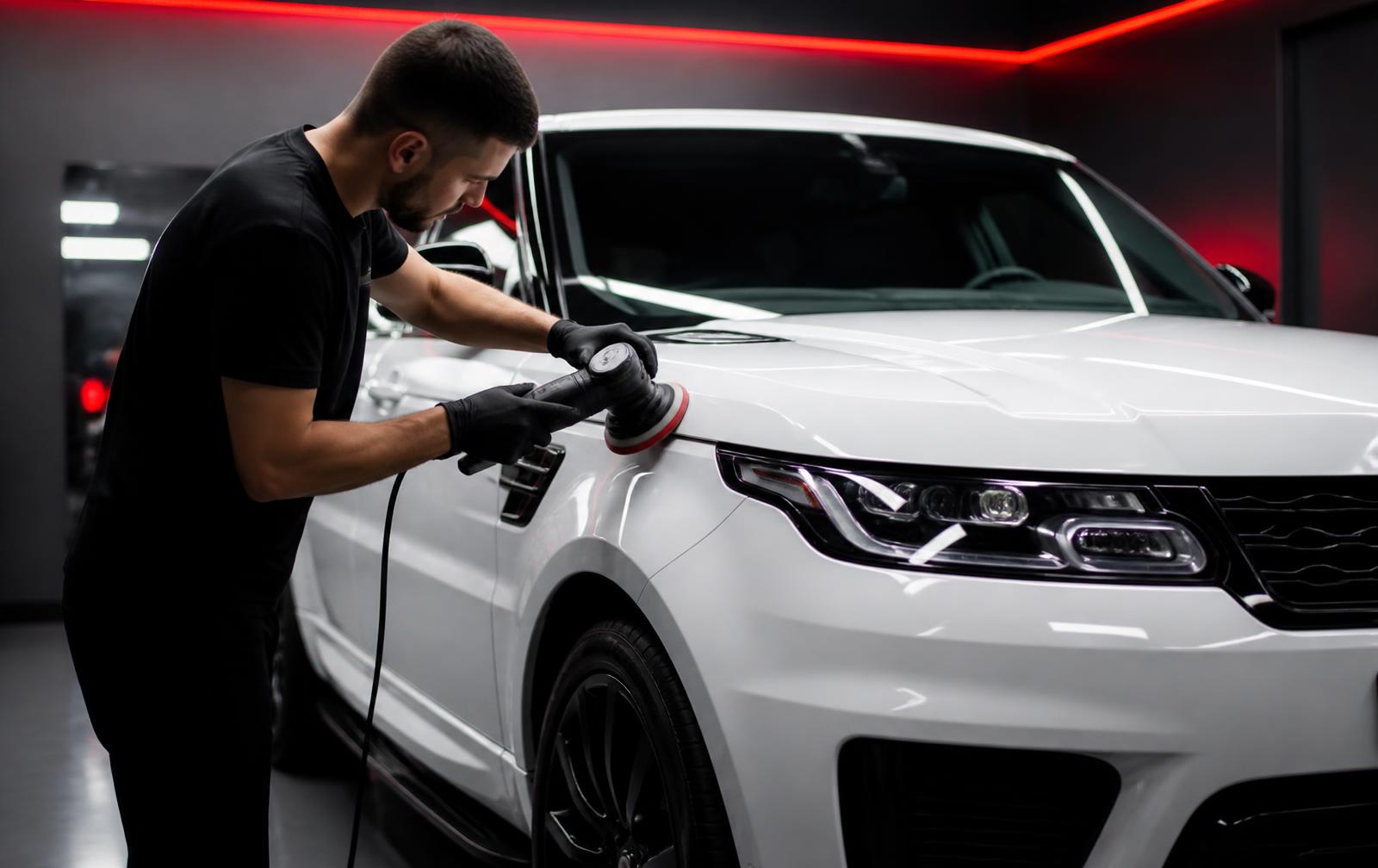 Nano Ceramic Pros technician machine polishing an SUV before Revivify coating application